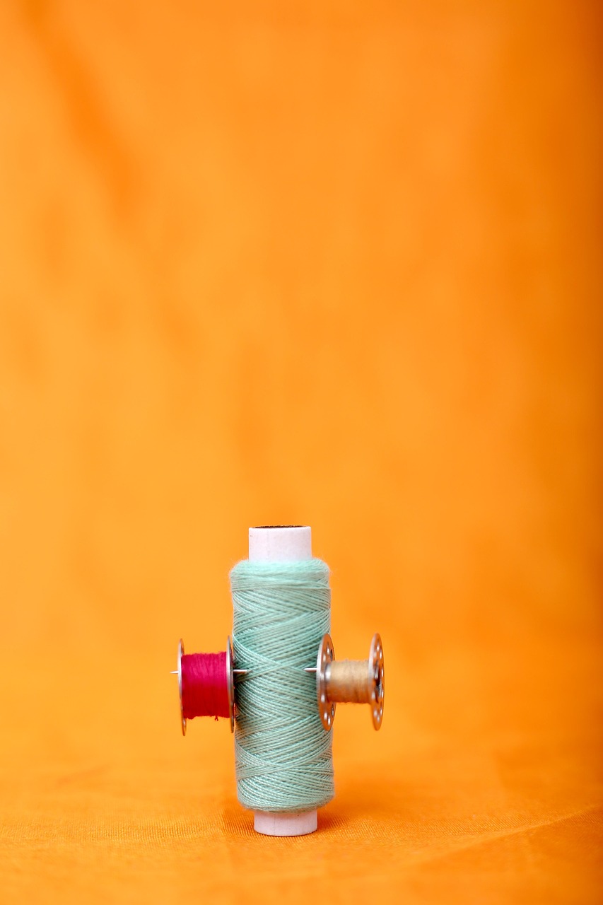 thread, embroidery, sewing, garment, fabric, manufacturing, reel, tailor, fashion, accessories, cloth, color, craft, design, industry, material, colorful, colors, crafts, multicolored, spool, yarn, clothing, tailoring, sewing thread, orange fashion, orange clothes, orange design, orange industry